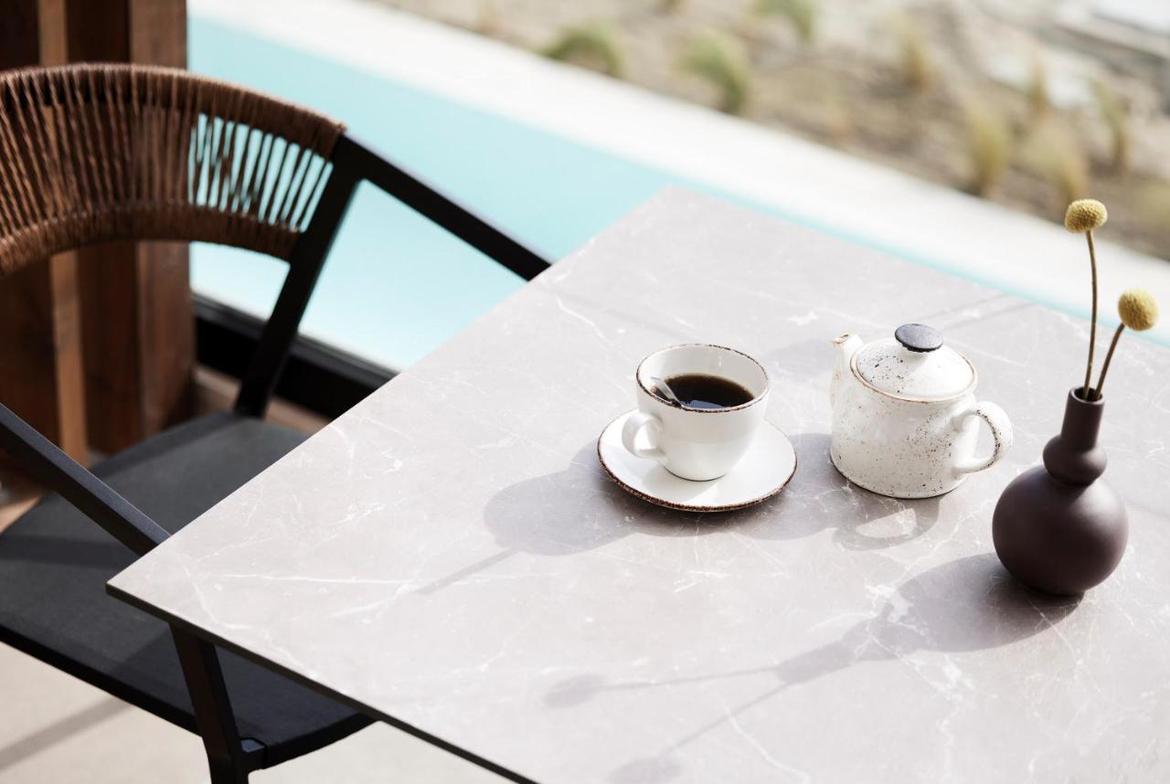 Helea Lifestyle Beach Resort Kallithéa 外观 照片 A table with a porcelain tabletop