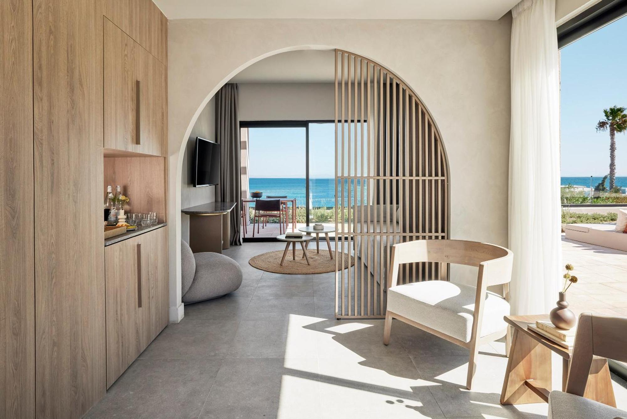 Helea Lifestyle Beach Resort Kallithéa 客房 照片 Interior of a suite at the hotel